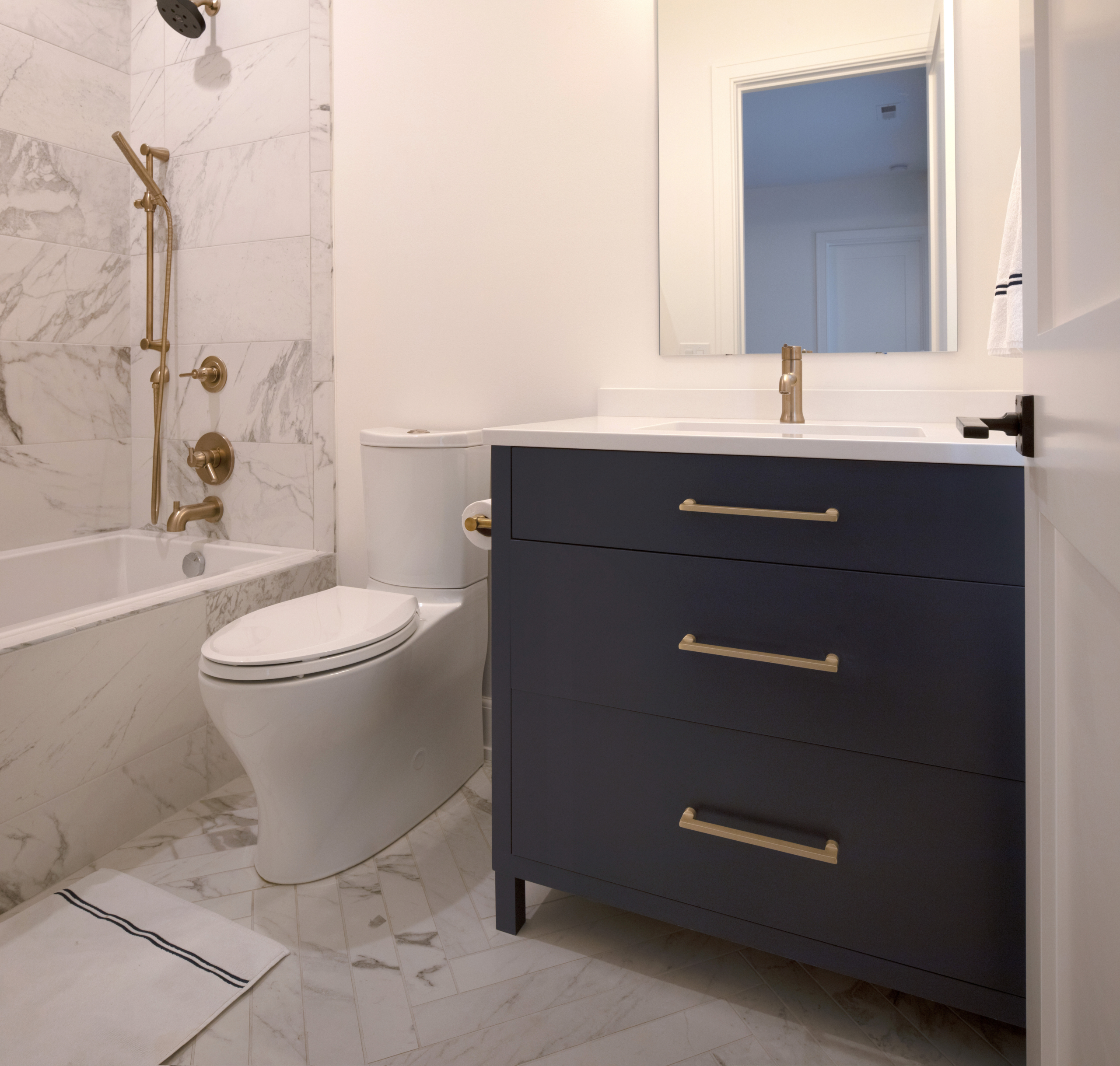 Small bathroom with navy single vanity sink