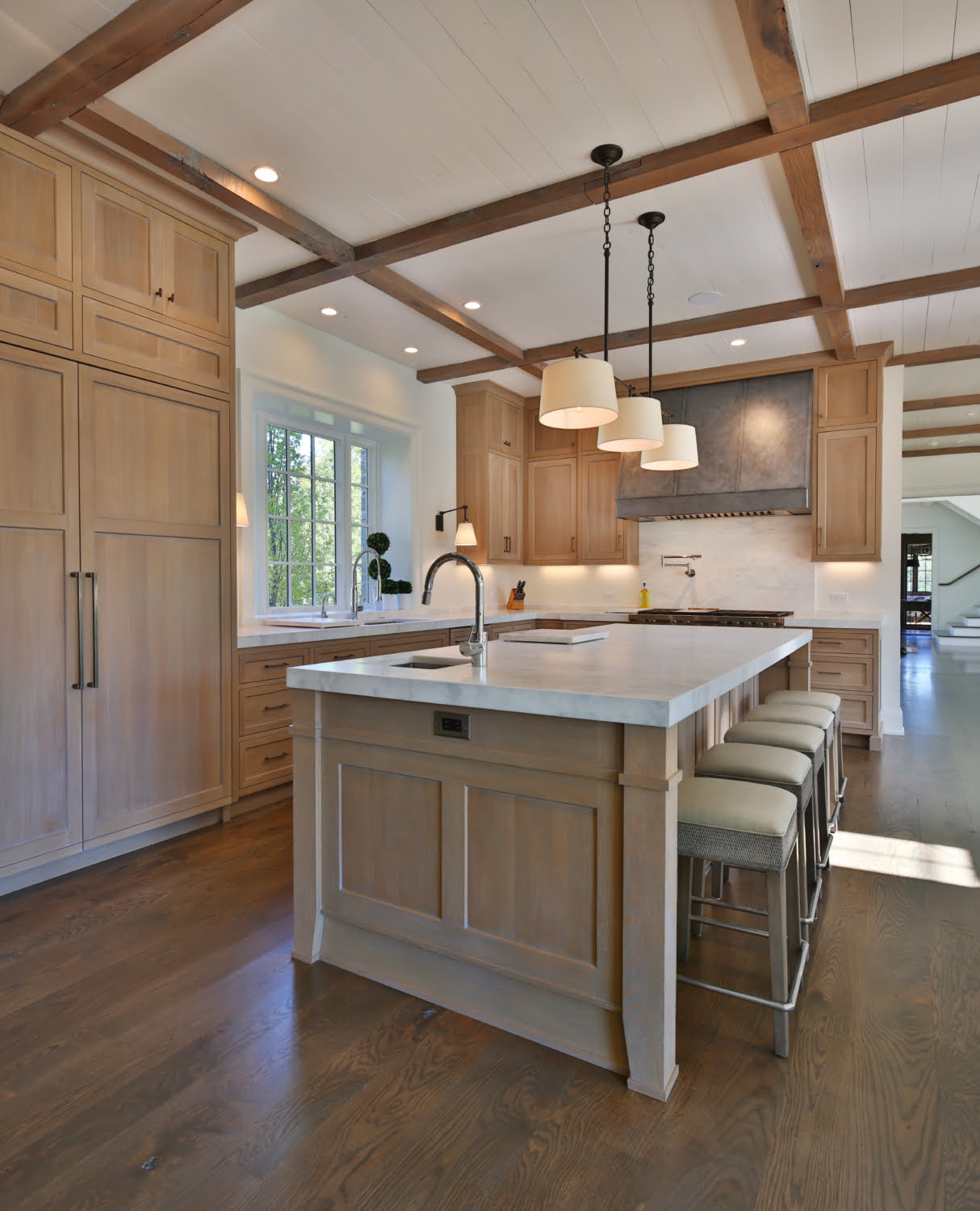 Natural wood cabinets with matching island details