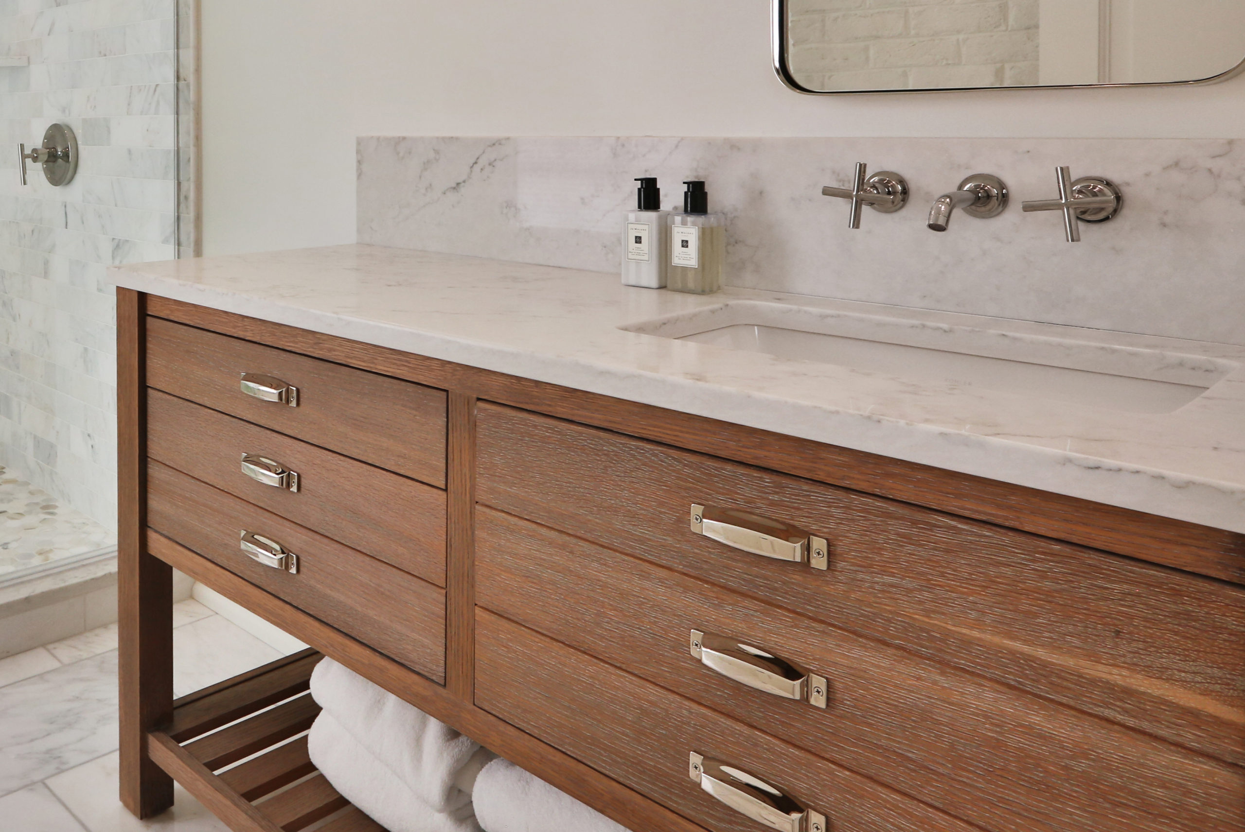 Bathroom vanity medium wood with open shelving below drawers