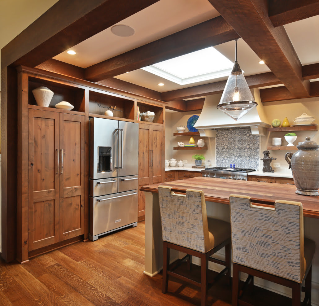 Medium wood farmhouse style kitchen island with seating