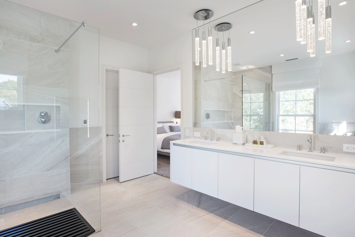 Open airy white bathroom and floating double vanity