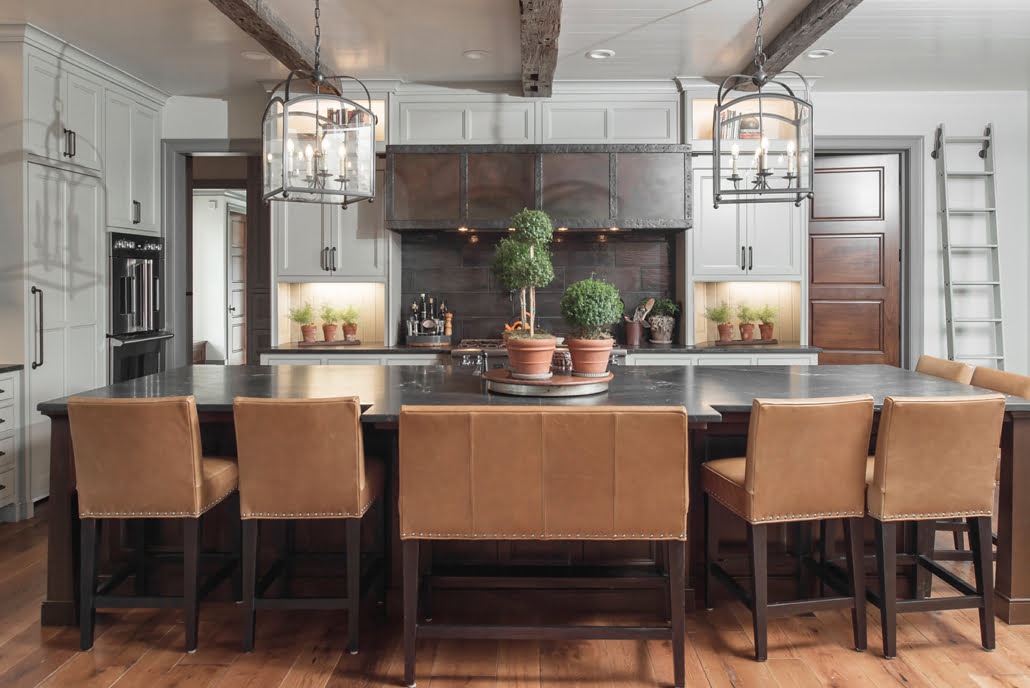Dark wood kitchen island with leather bench seating