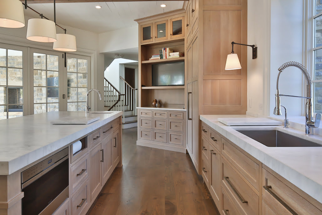 Natural wood cabinets with white countertops