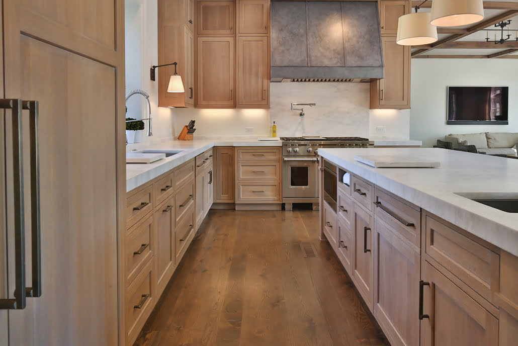 Natural wood cabinets with matching island details view 2